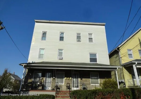 a view of a house with roof deck