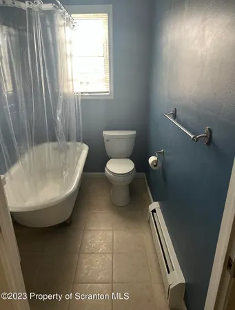 a bathroom with a toilet and a sink