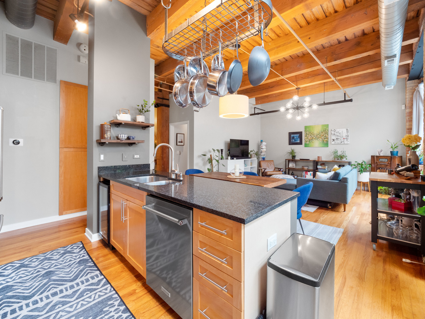 1750 North Wolcott Avenue, Unit 104 Chicago, IL 60622 - Photo 12 of 32 a kitchen with stainless steel appliances granite countertop a sink and cabinets