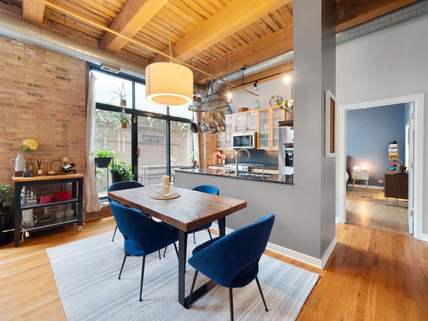 1750 North Wolcott Avenue, Unit 104 Chicago, IL 60622 - Photo 13 of 32 a view of a dining room with furniture window and wooden floor
