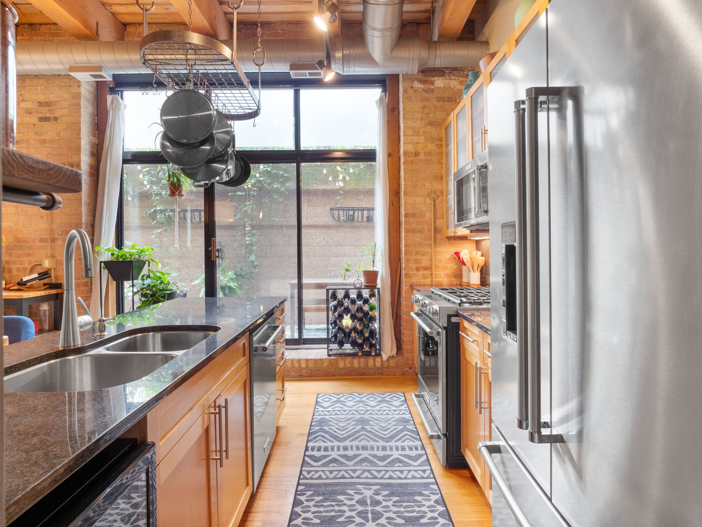 1750 North Wolcott Avenue, Unit 104 Chicago, IL 60622 - Photo 14 of 32 a kitchen with counter top space and a sink