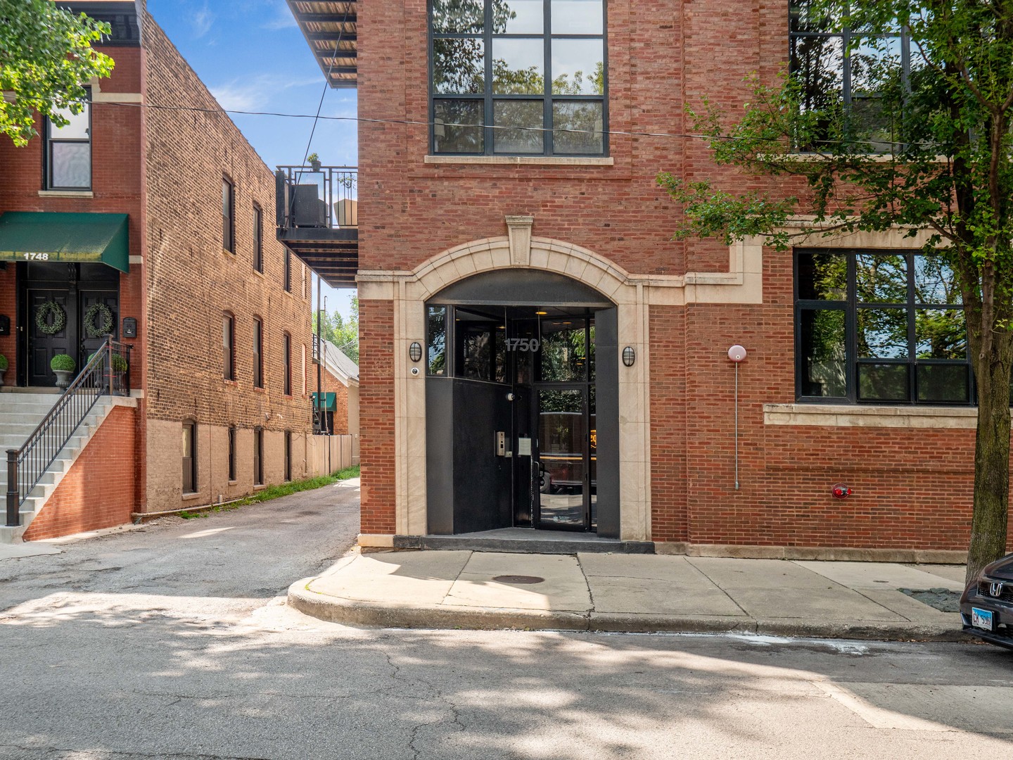 1750 North Wolcott Avenue, Unit 104 Chicago, IL 60622 - Photo 2 of 32 a front view of a house with a yard
