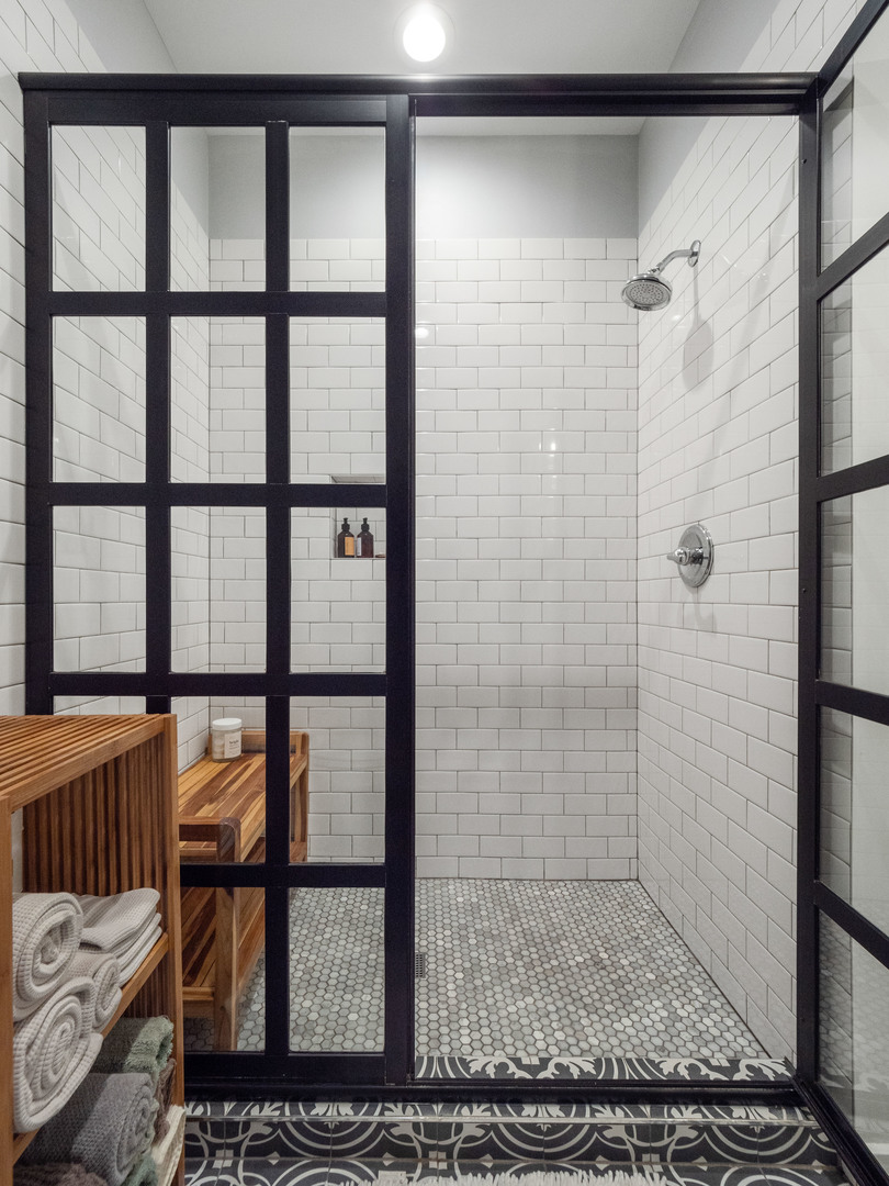 1750 North Wolcott Avenue, Unit 104 Chicago, IL 60622 - Photo 22 of 32 a bathroom with a glass door shower