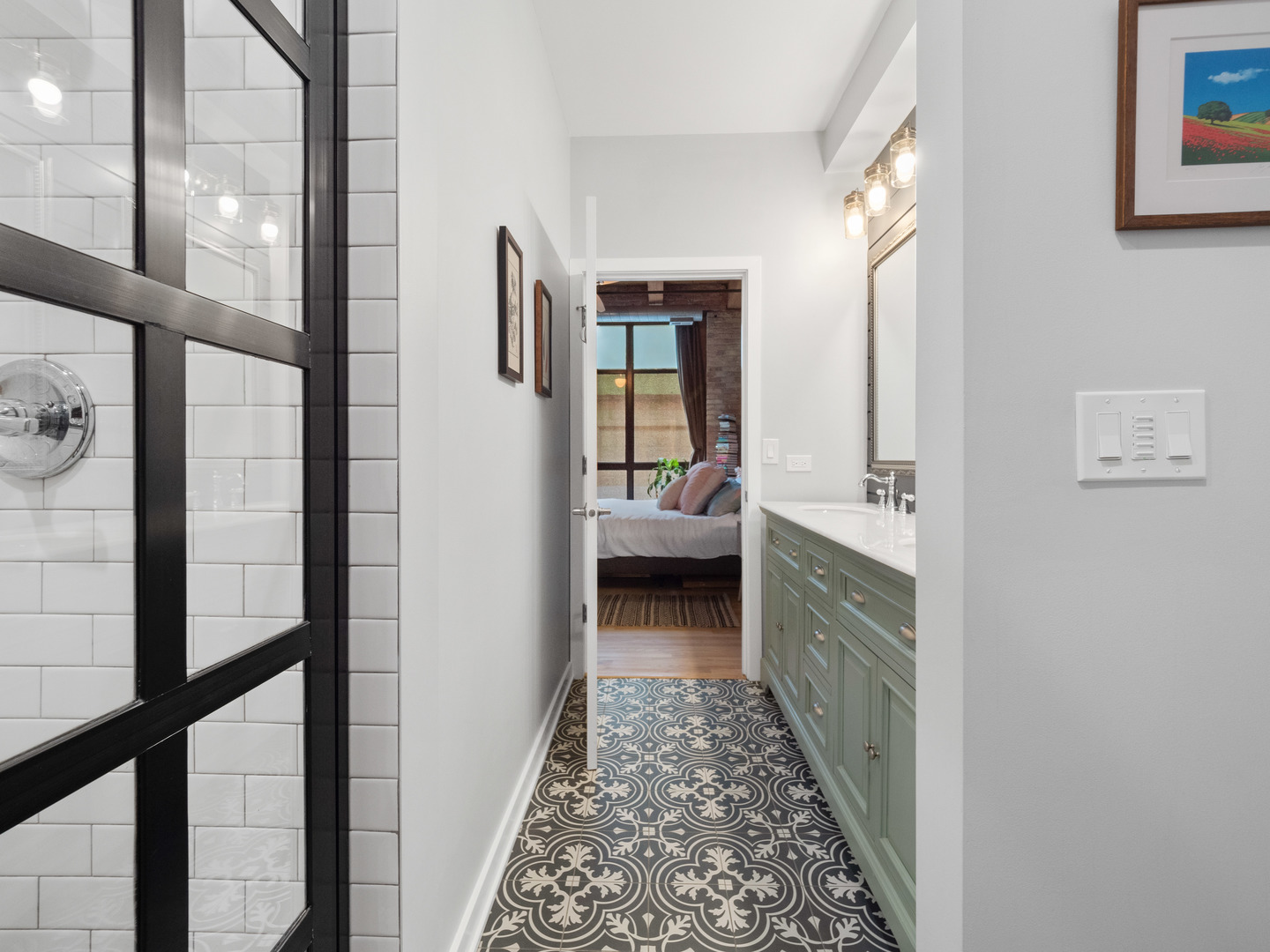 1750 North Wolcott Avenue, Unit 104 Chicago, IL 60622 - Photo 23 of 32 a en suite bathroom with a sink a mirror and a shower