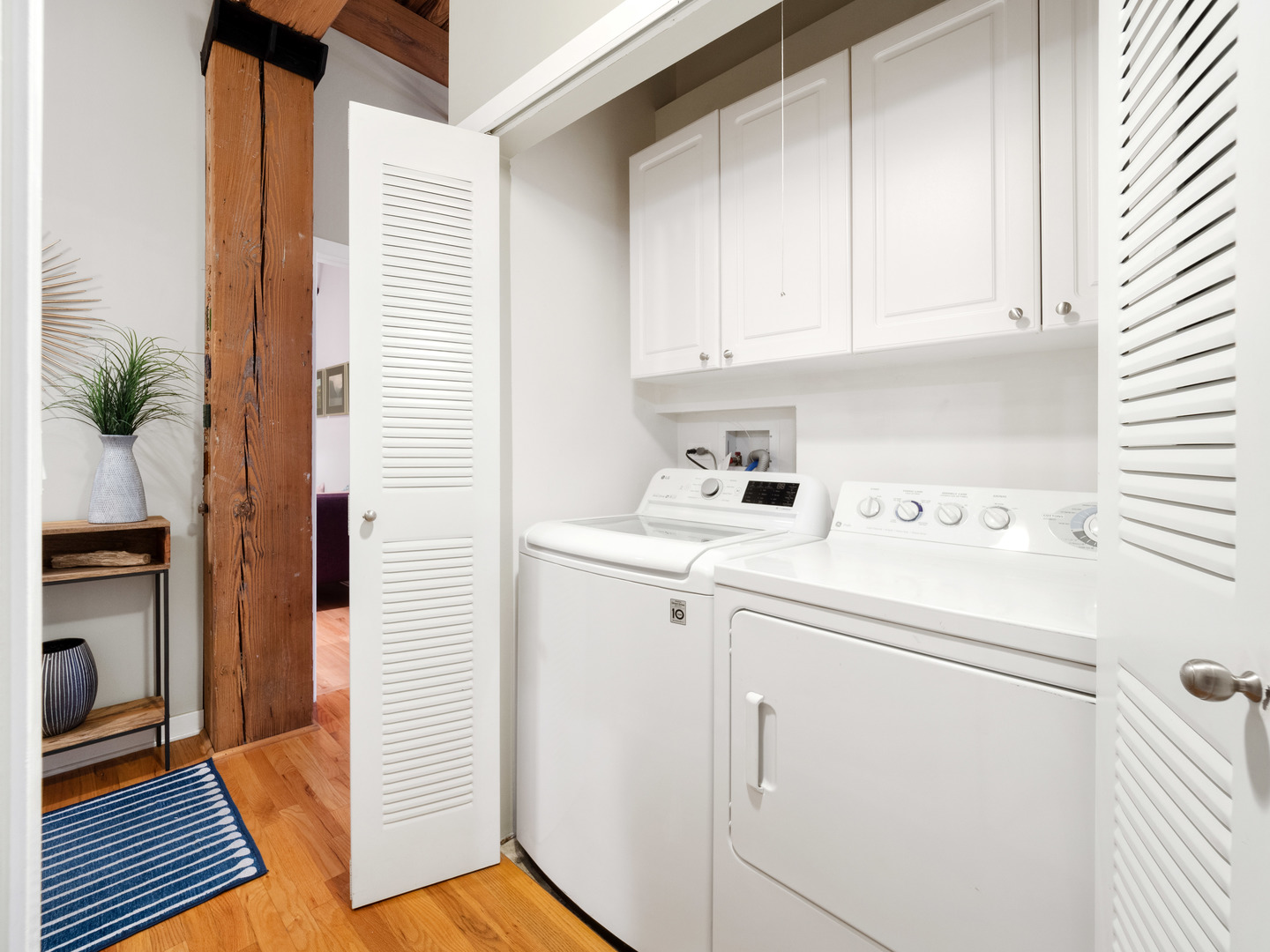 1750 North Wolcott Avenue, Unit 104 Chicago, IL 60622 - Photo 28 of 32 a view of storage and utility room with washer and dryer