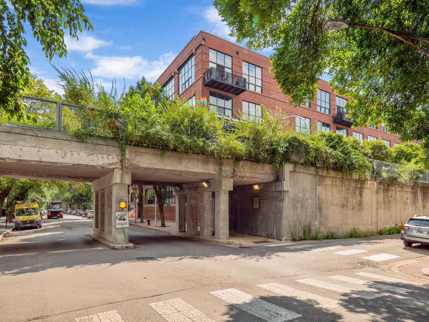 1750 North Wolcott Avenue, Unit 104 Chicago, IL 60622 - Photo 30 of 32 a front view of a building with a garden
