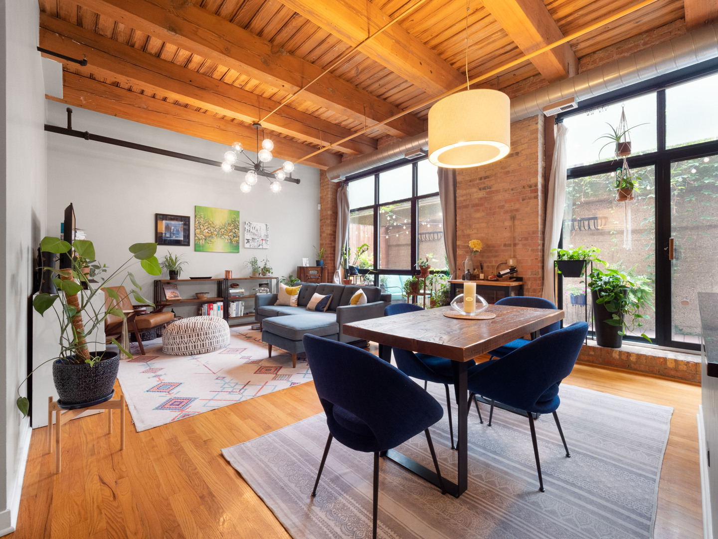 1750 North Wolcott Avenue, Unit 104 Chicago, IL 60622 - Photo 4 of 32 a view of a dining room with furniture window and wooden floor