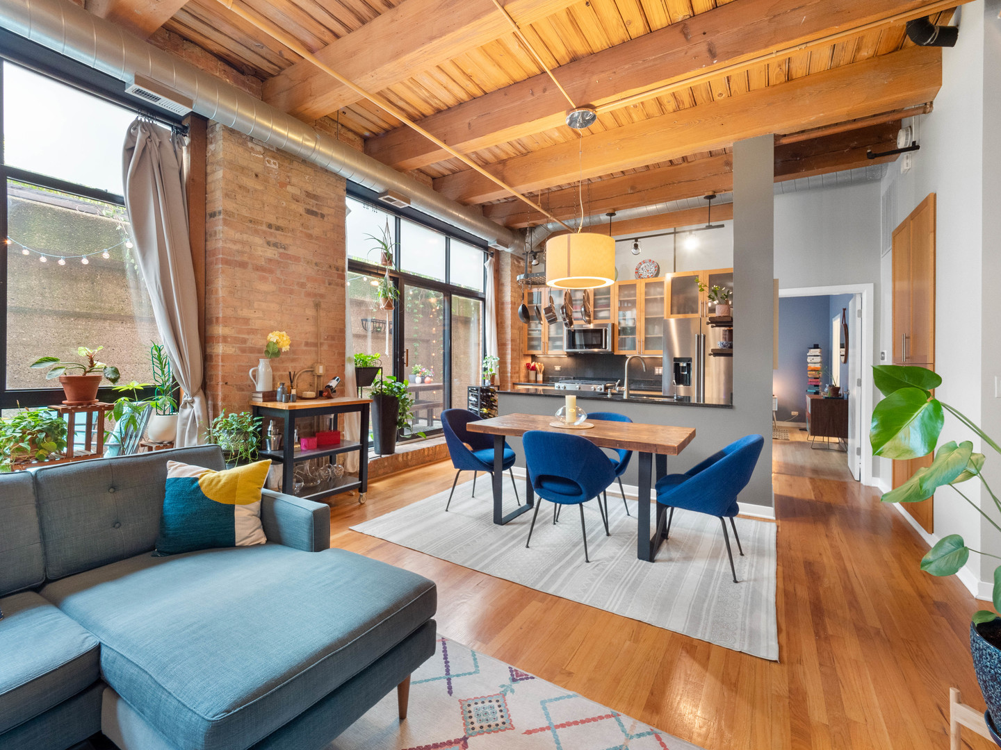 1750 North Wolcott Avenue, Unit 104 Chicago, IL 60622 - Photo 7 of 32 a view of a dining room with furniture window and wooden floor