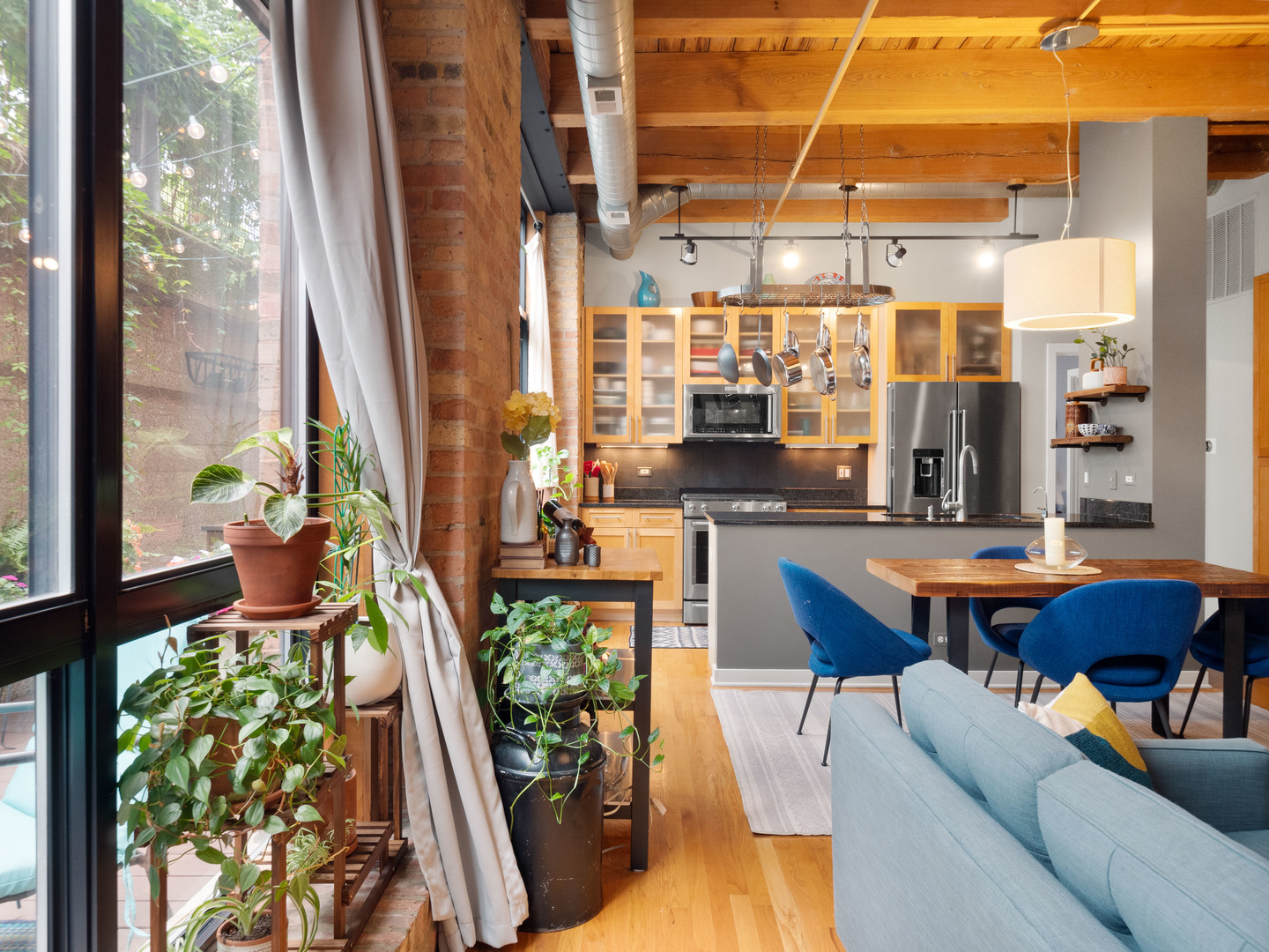 1750 North Wolcott Avenue, Unit 104 Chicago, IL 60622 - Photo 9 of 32 a outdoor living space with furniture and a potted plant