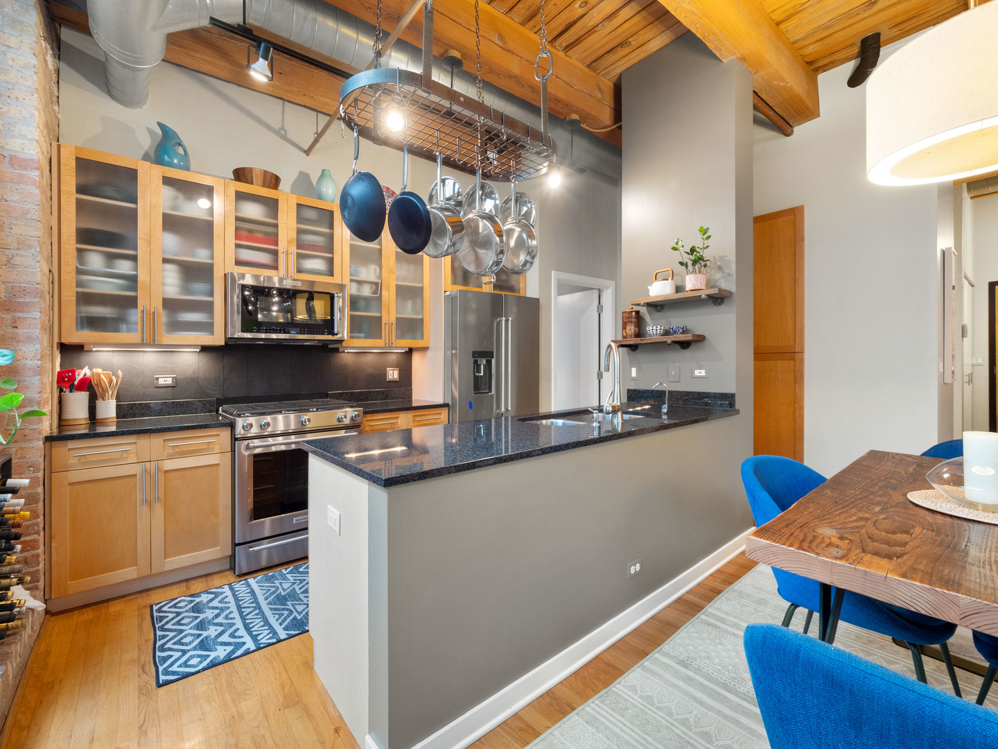 1750 North Wolcott Avenue, Unit 104 Chicago, IL 60622 - Photo 10 of 32 a kitchen with stainless steel appliances granite countertop a stove and a refrigerator