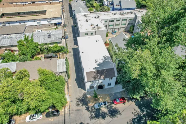 an aerial view of a house with outdoor space
