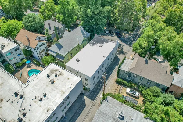 an aerial view of a house with outdoor space