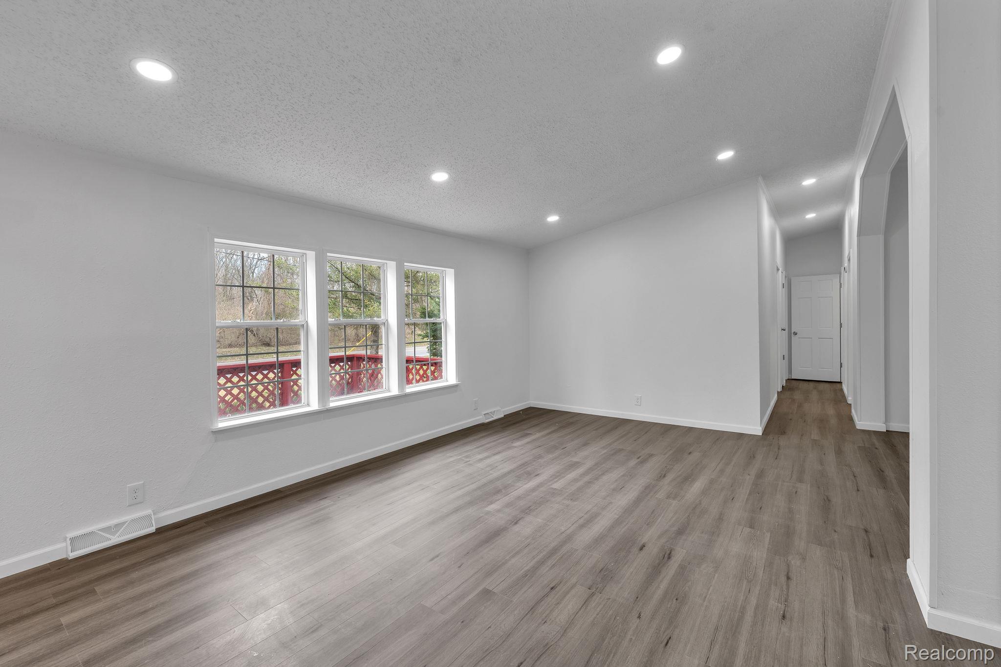 36085 Wick Road Romulus, MI 48174 - Photo 19 of 43 Spare room with recessed lighting, wood finished floors, and a textured ceiling