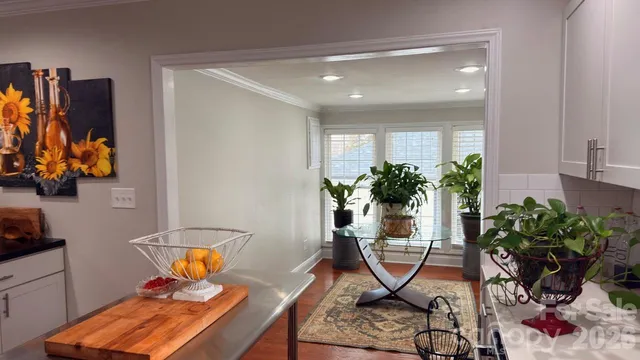 a kitchen with a refrigerator and window