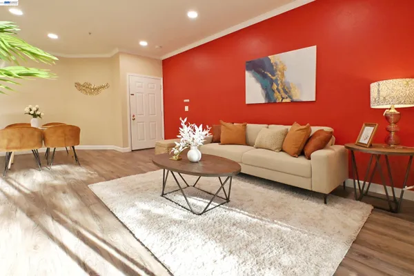 a living room with furniture and a rug