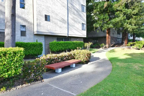 a view of parking garage with cars parked