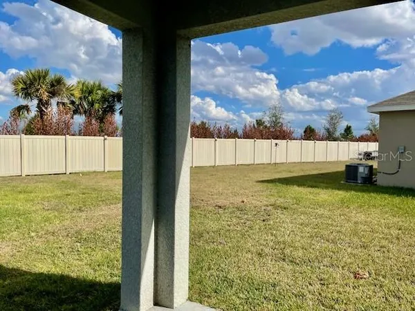 a view of swimming pool from a yard