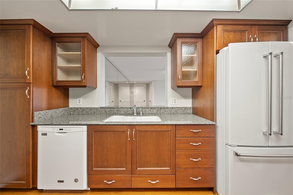 2611 Bayshore Boulevard, Unit 504 Tampa, FL 33629 - Photo 12 of 39 a bathroom with a granite countertop sink and a refrigerator