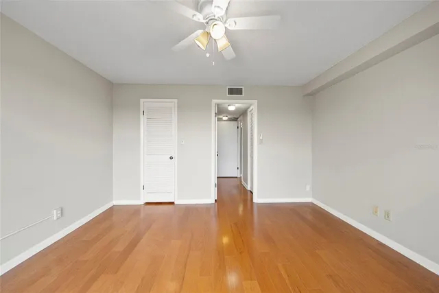 a view of a bathroom with shower curtain