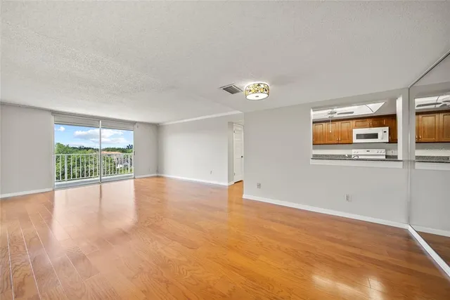 a kitchen with a stove and cabinets