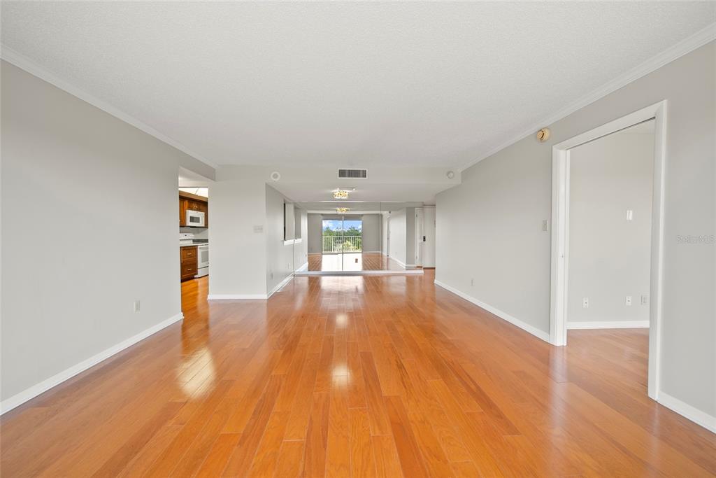 2611 Bayshore Boulevard, Unit 504 Tampa, FL 33629 - Photo 10 of 39 wooden floor in an empty room with a window