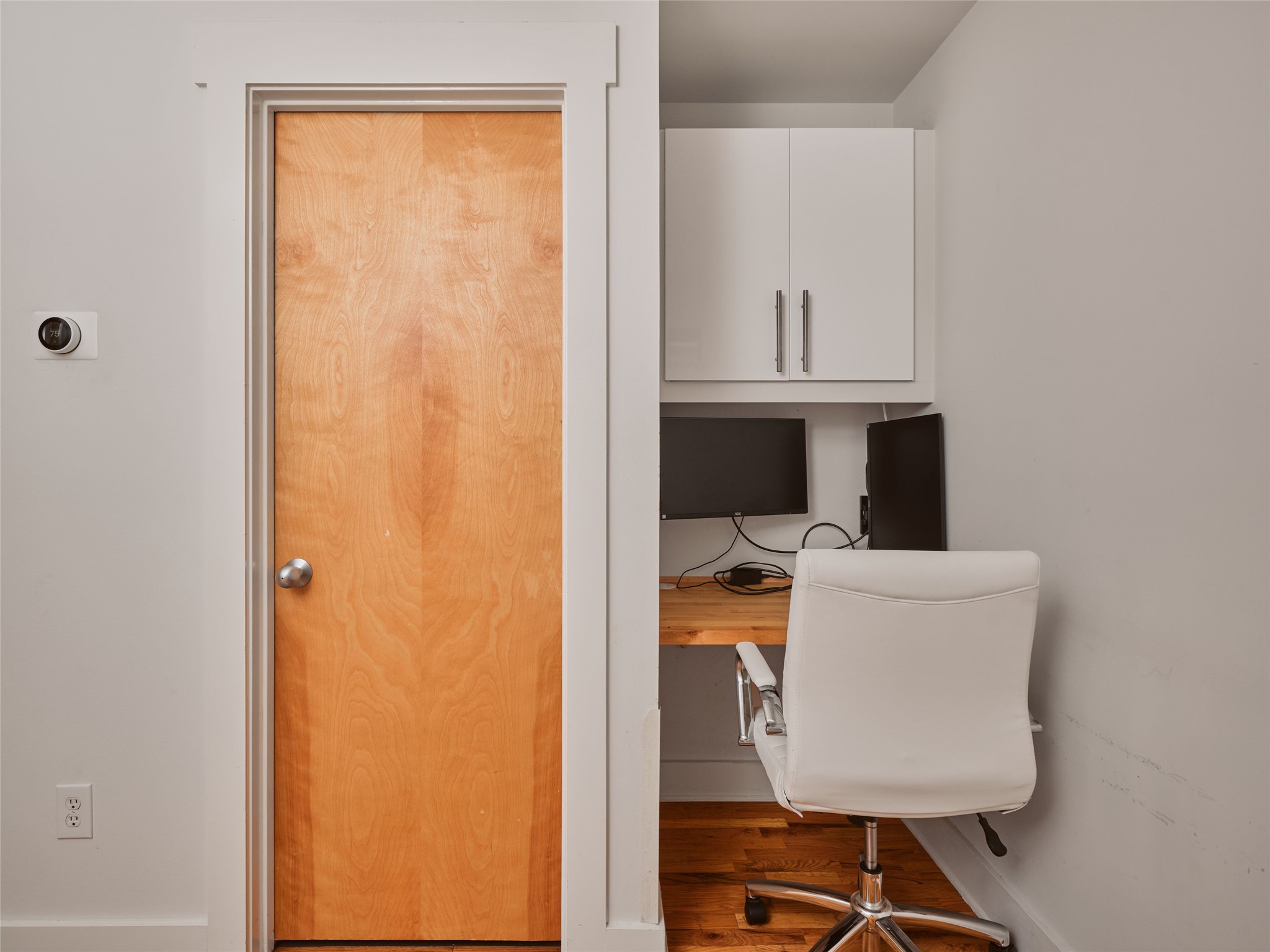 2002 East 13th Street, Unit A Austin, TX 78702 - Photo 18 of 37 Office area with wood finished floors and built in desk