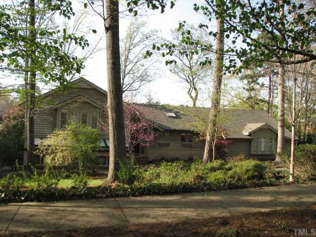 1409 Hunting Ridge Road Raleigh, NC 27615 - Photo 1 of 12 The transitional homes has a wooded front lot Exterior Front