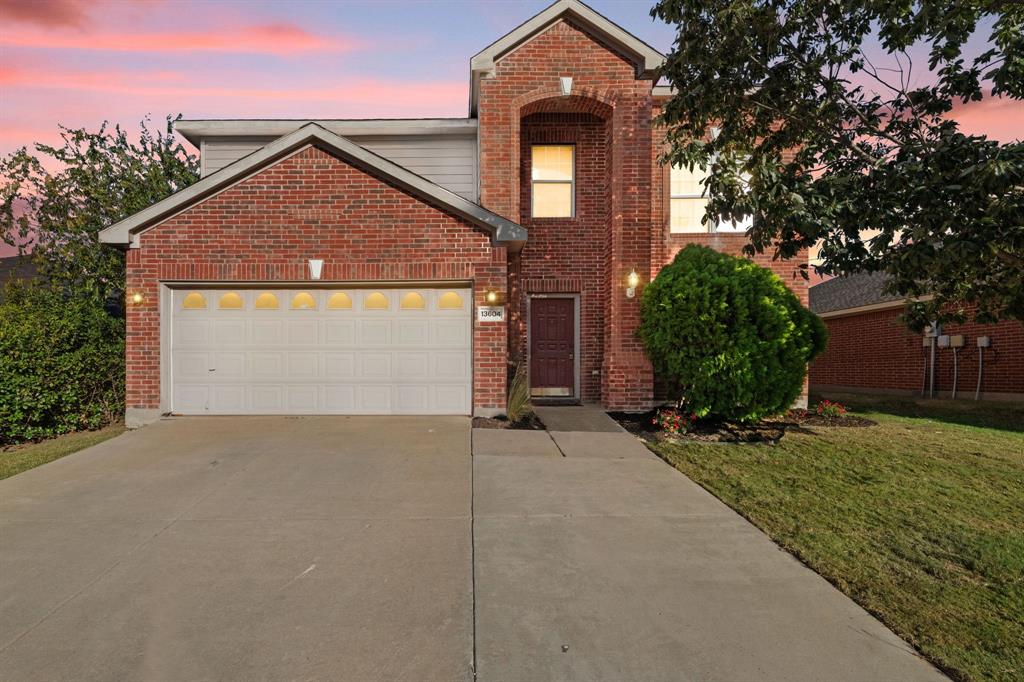13604 Ponderosa Ranch Road Fort Worth, TX 76262 - Photo 1 of 27 a front view of a house with a yard and garage