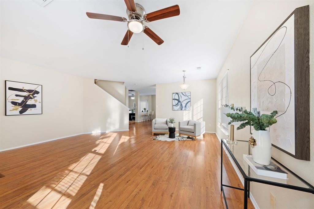 13604 Ponderosa Ranch Road Fort Worth, TX 76262 - Photo 21 of 27 a living room with furniture and a potted plant