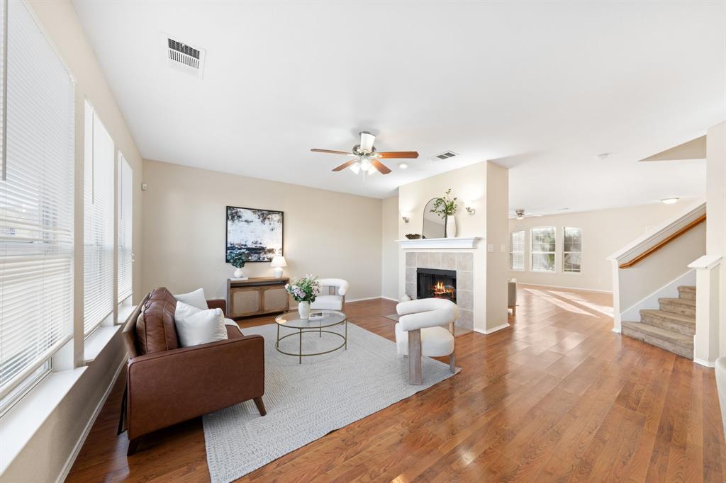 13604 Ponderosa Ranch Road Fort Worth, TX 76262 - Photo 4 of 27 a living room with fireplace furniture and a wooden floor