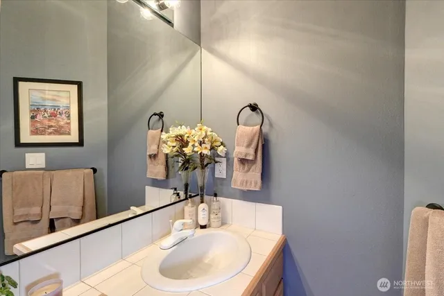 a bathroom with a shower curtain a bath tub and a shower