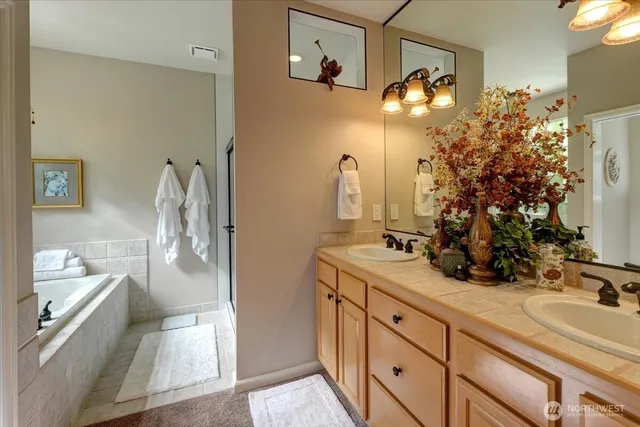 a bath tub sitting in a bathroom next to a window