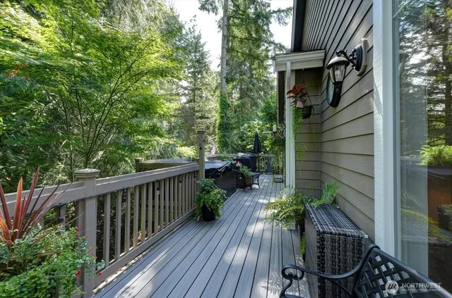 a view of backyard with seating space and trees