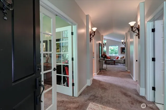 a work room with furniture and a large window