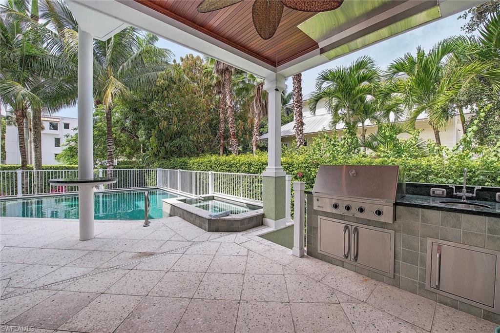 85 13th Avenue South Naples, FL 34102 - Photo 13 of 13 a view of a backyard with chairs