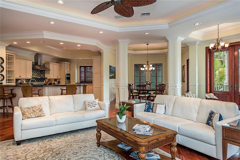 85 13th Avenue South Naples, FL 34102 - Photo 3 of 13 a living room with furniture and kitchen view