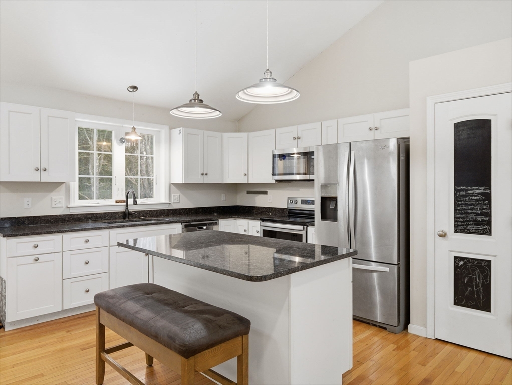 661 Wheelwright Road Barre, MA 01005 - Photo 11 of 42 a kitchen with stainless steel appliances granite countertop a stove refrigerator sink and microwave