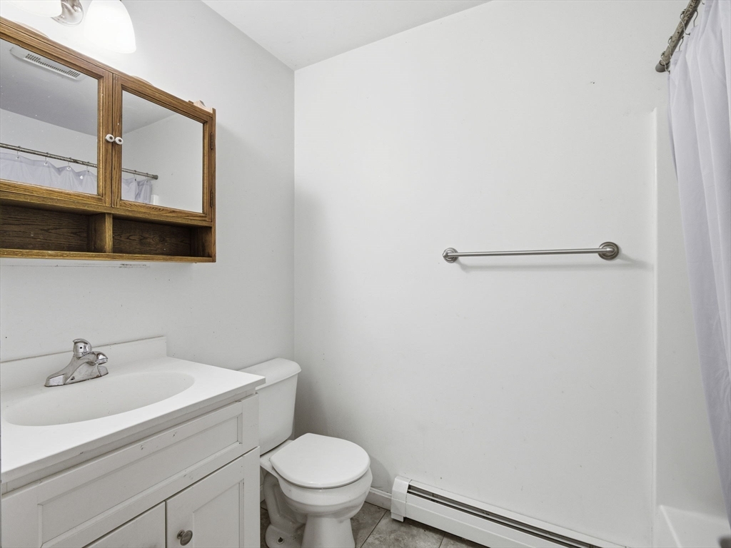 661 Wheelwright Road Barre, MA 01005 - Photo 20 of 42 a white toilet sitting next to a bathroom sink