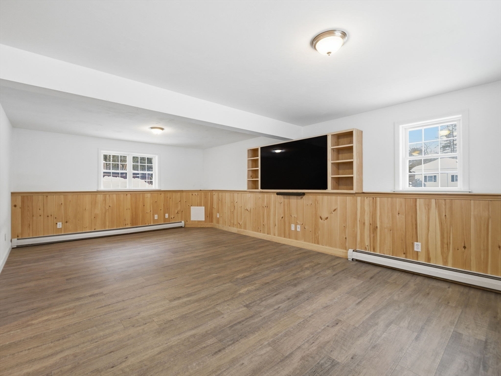 661 Wheelwright Road Barre, MA 01005 - Photo 30 of 42 a view of an empty room with wooden floor and windows