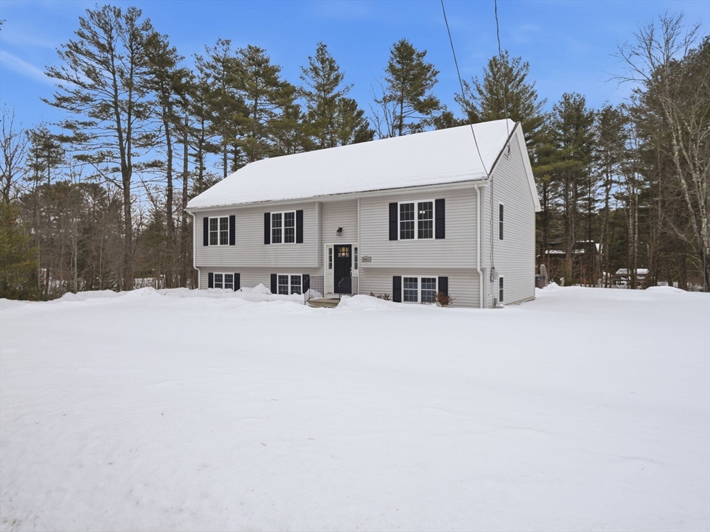 661 Wheelwright Road Barre, MA 01005 - Photo 3 of 42 a view of house with a yard covered in snow