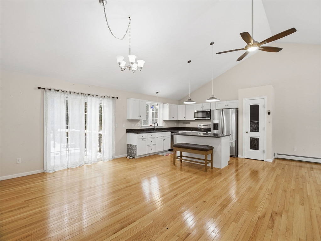 661 Wheelwright Road Barre, MA 01005 - Photo 9 of 42 a living room with stainless steel appliances kitchen island granite countertop furniture and a kitchen view