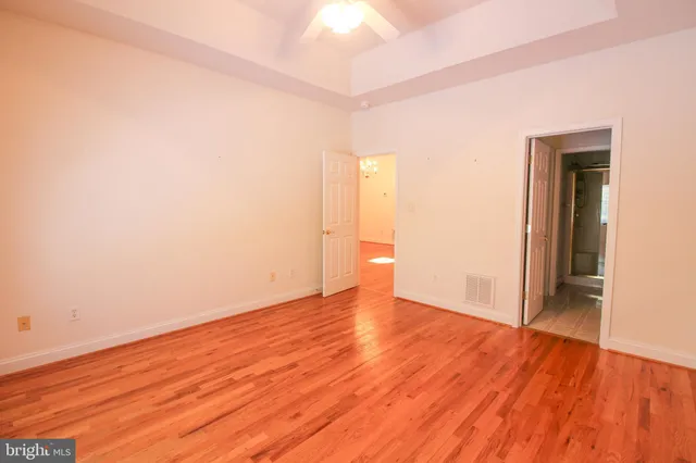 a large bathroom with a double vanity sink a mirror and a shower