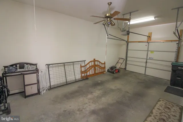 a view of room with a ceiling fan