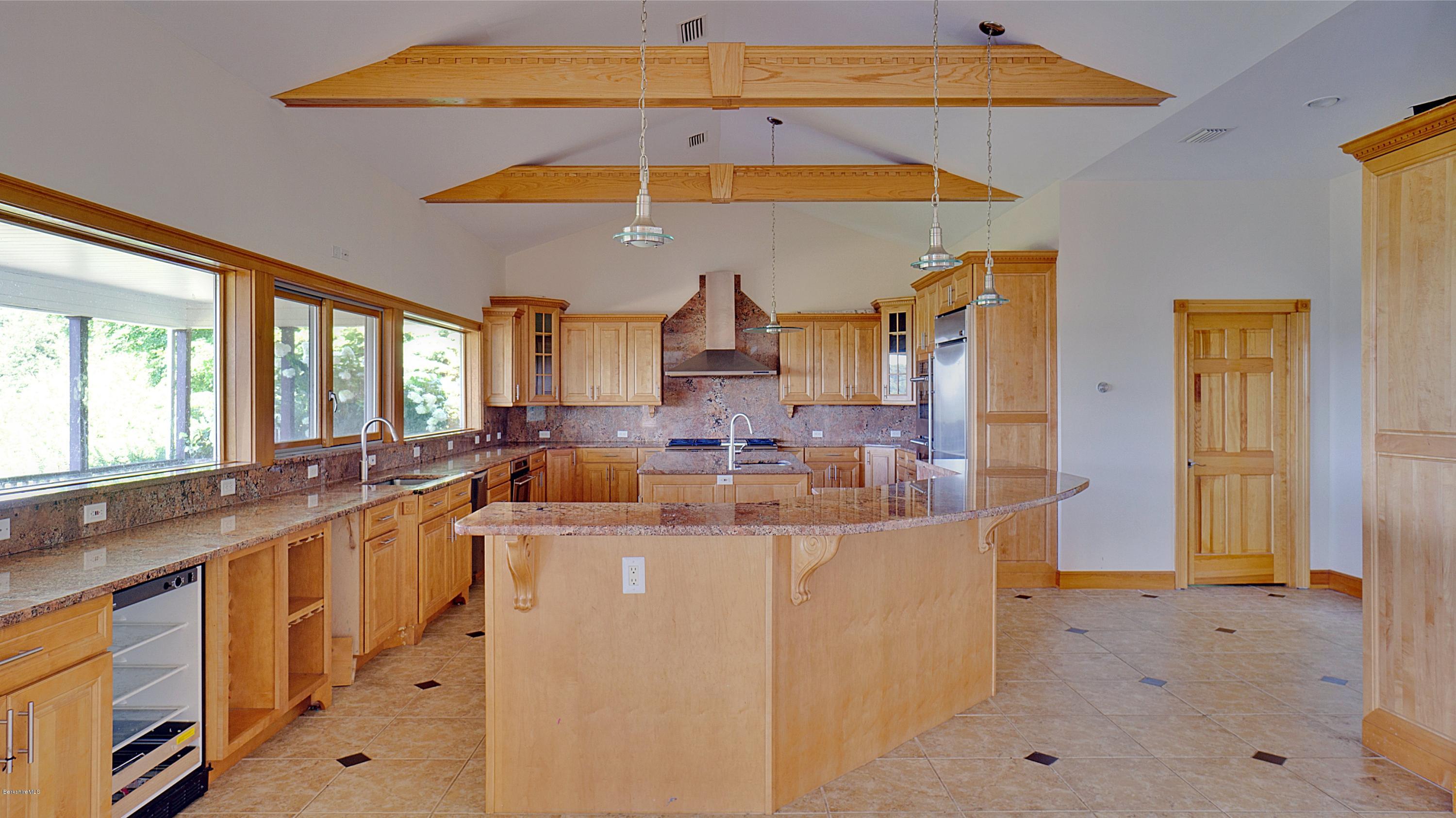 79 Hupi Road Monterey, MA 01245 - Photo 11 of 33 a large kitchen with a lot of counter space and a sink