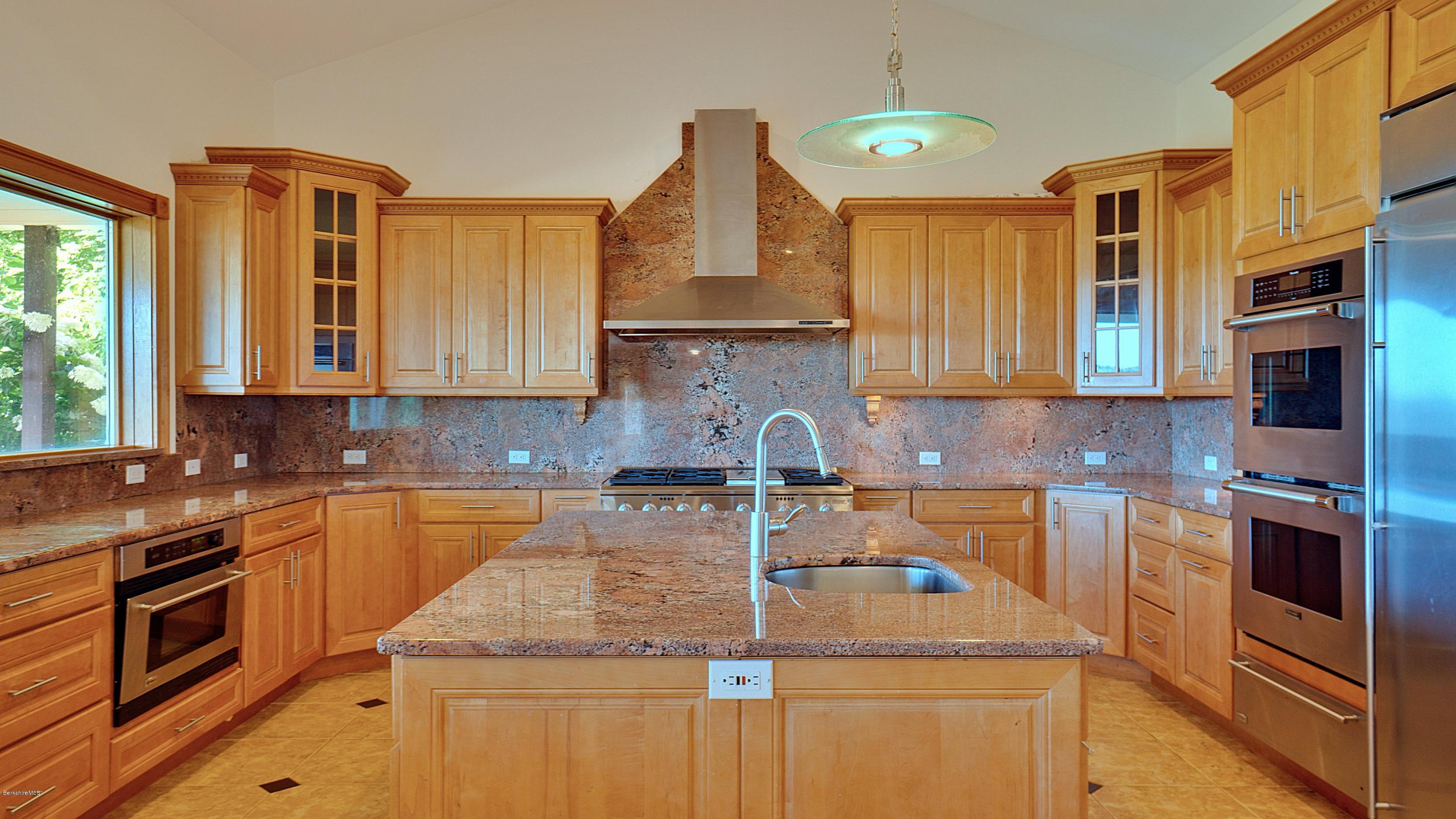79 Hupi Road Monterey, MA 01245 - Photo 12 of 33 a kitchen with stainless steel appliances granite countertop a sink a stove and a refrigerator