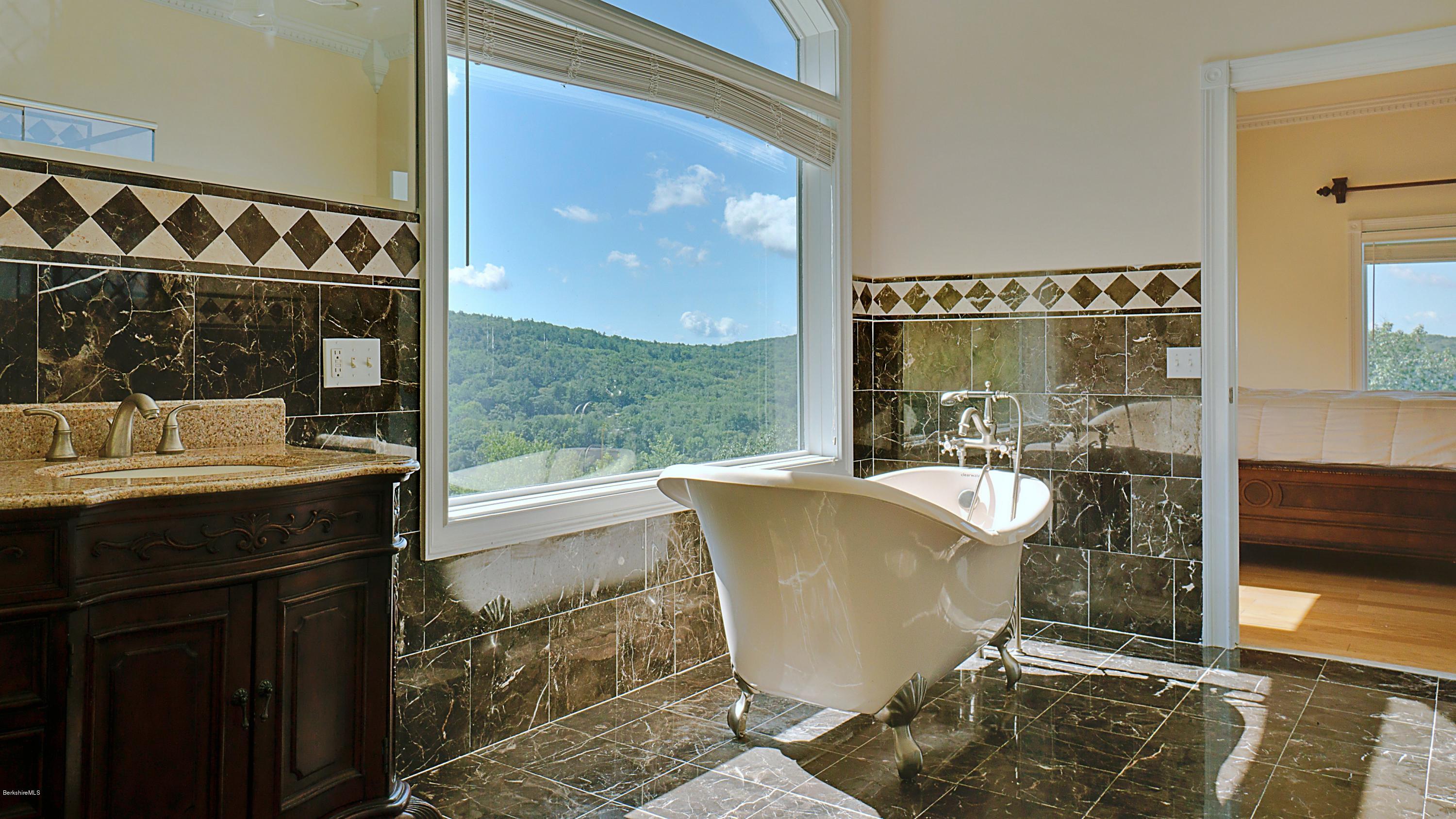 79 Hupi Road Monterey, MA 01245 - Photo 16 of 33 a bath room with a sink and a mirror
