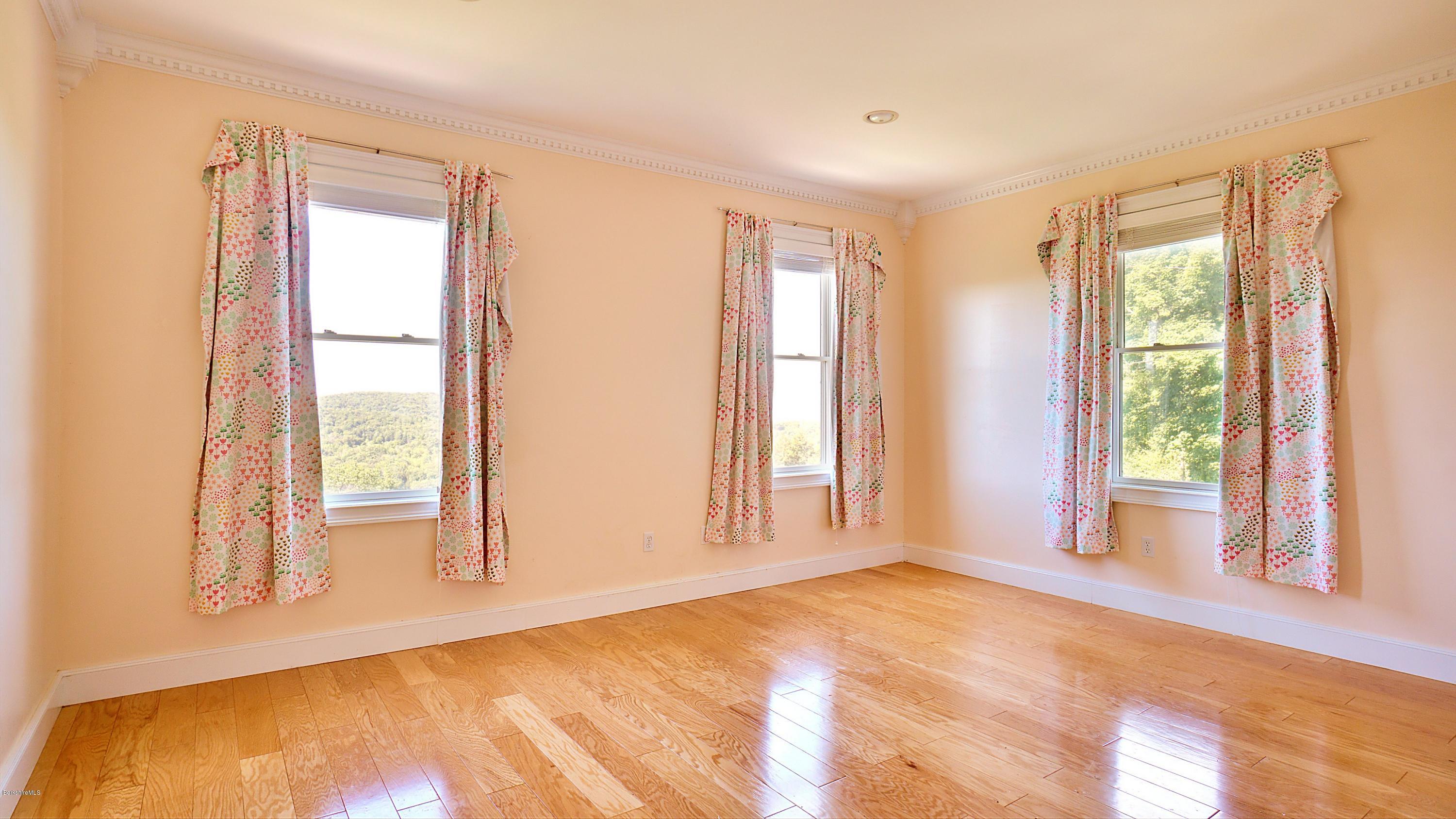 79 Hupi Road Monterey, MA 01245 - Photo 19 of 33 a view of an empty room with a window