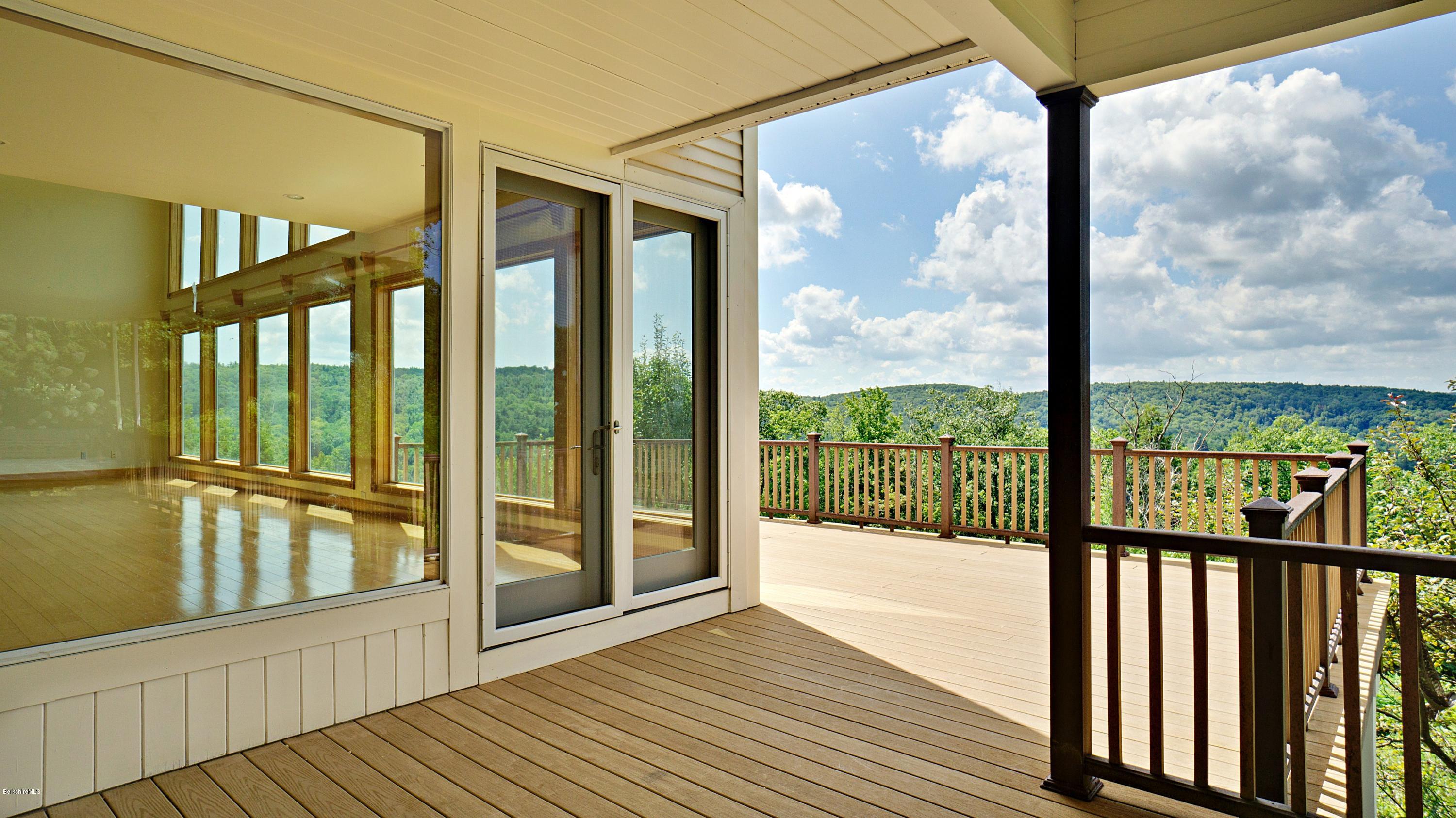 79 Hupi Road Monterey, MA 01245 - Photo 4 of 33 a view of a balcony with wooden floor