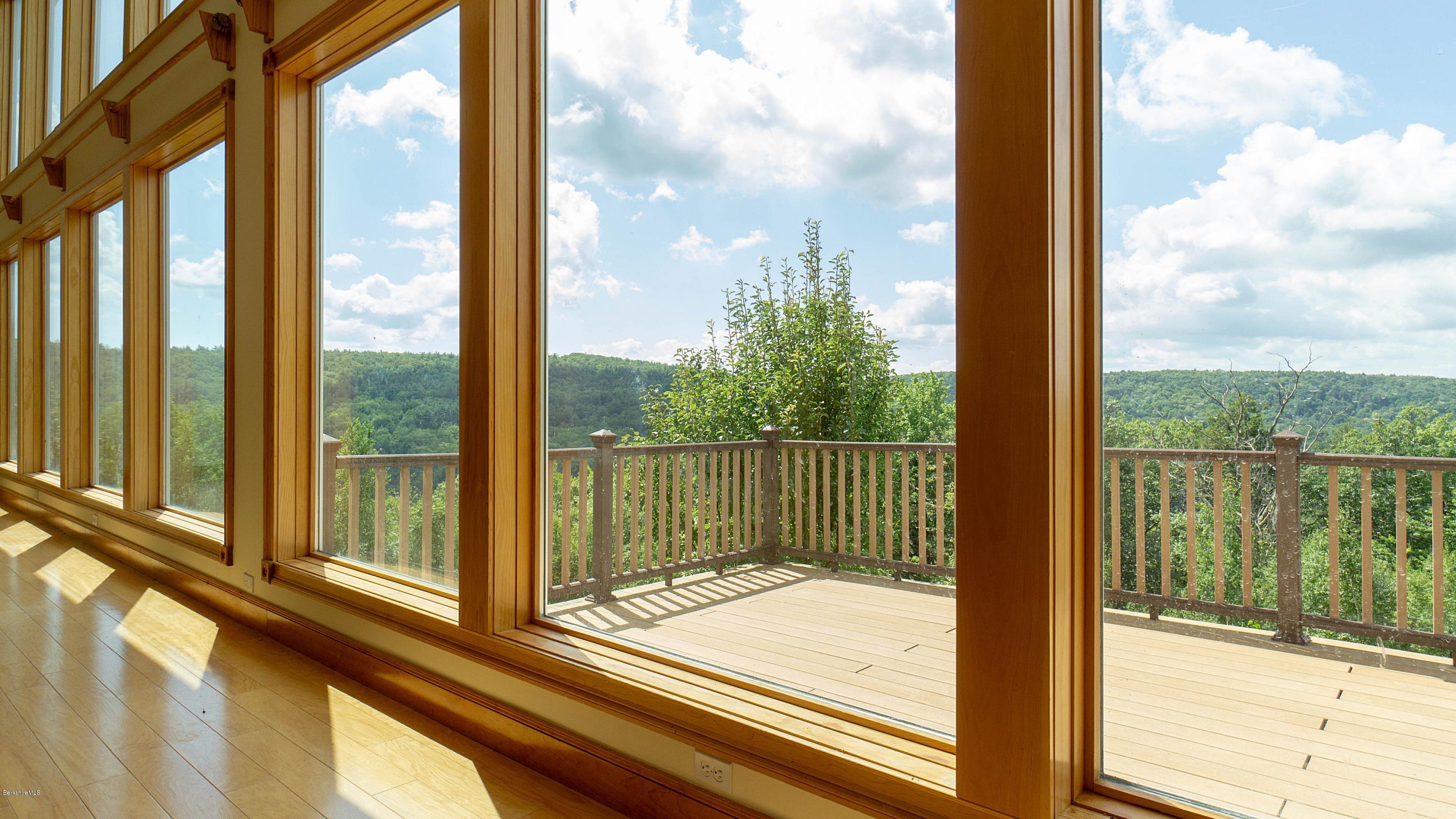 79 Hupi Road Monterey, MA 01245 - Photo 5 of 33 a view of a glass door with a from a window
