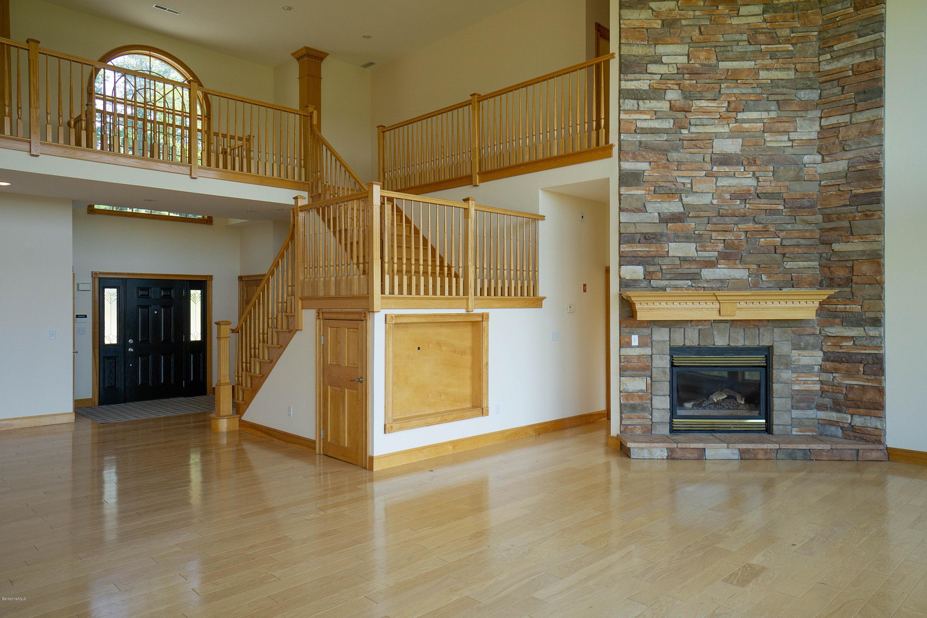 79 Hupi Road Monterey, MA 01245 - Photo 7 of 33 a view of livingroom with fireplace and window